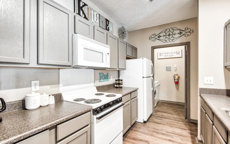 a kitchen with white appliances