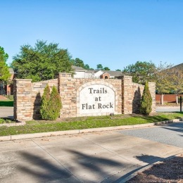 a large sign with trees
