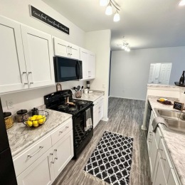 a kitchen with white cabinets