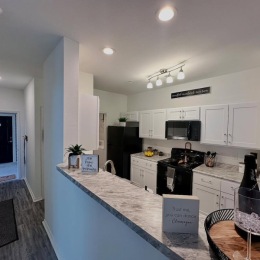 a kitchen with white cabinets